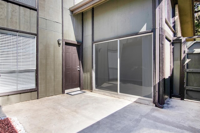 entrance to property featuring a patio area