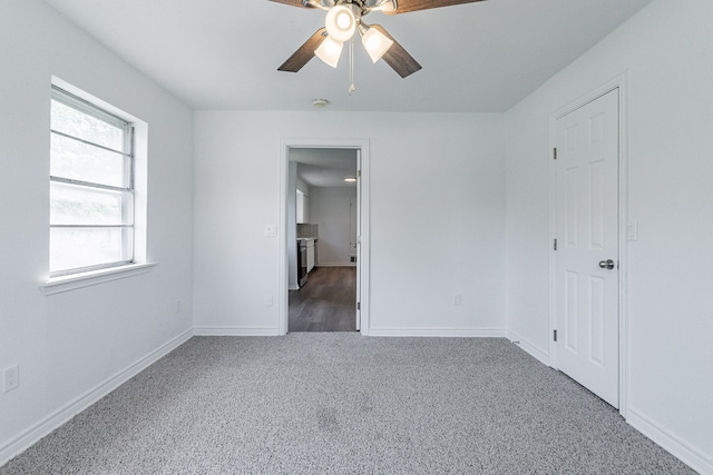 unfurnished bedroom featuring carpet flooring and ceiling fan