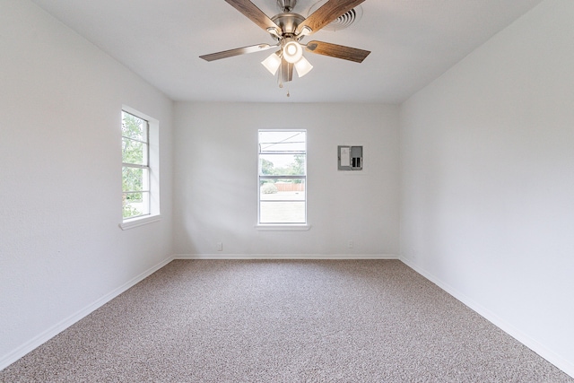 unfurnished room featuring ceiling fan, carpet flooring, and electric panel