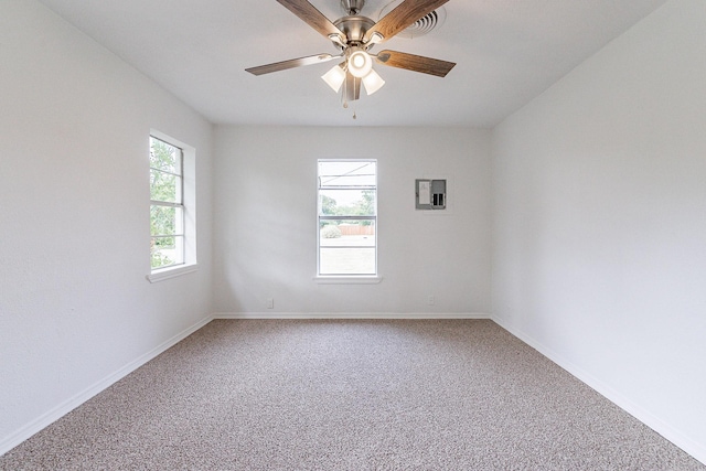 unfurnished room featuring carpet floors, a ceiling fan, and baseboards