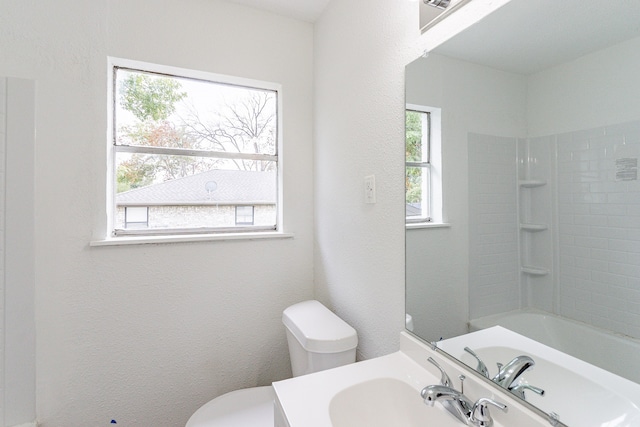 full bathroom with plenty of natural light, vanity, and toilet