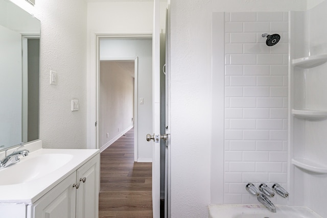 bathroom with shower with separate bathtub, vanity, and wood-type flooring