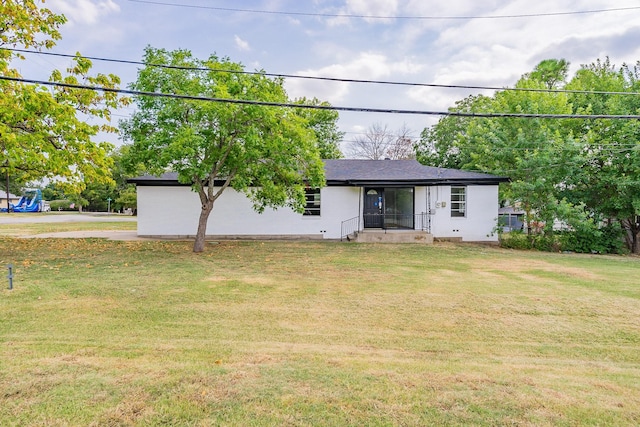 single story home featuring a front lawn and stucco siding