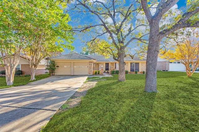 single story home featuring a front yard and a garage