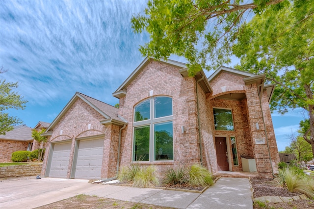 front facade with a garage