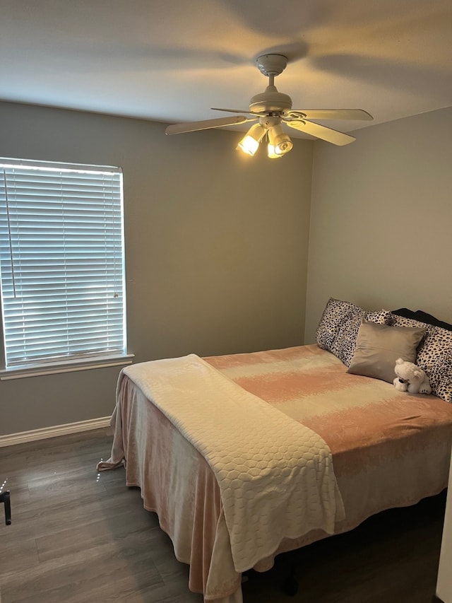 bedroom featuring ceiling fan and hardwood / wood-style flooring