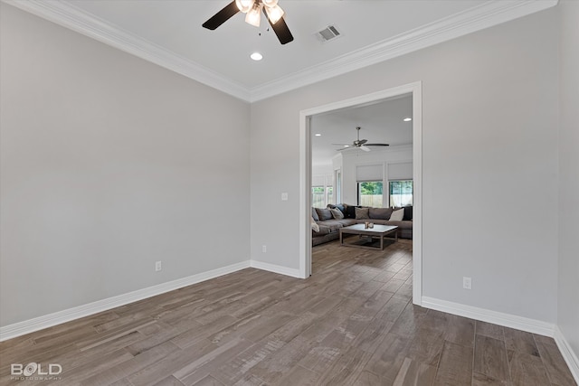 unfurnished room with ornamental molding, hardwood / wood-style floors, and ceiling fan