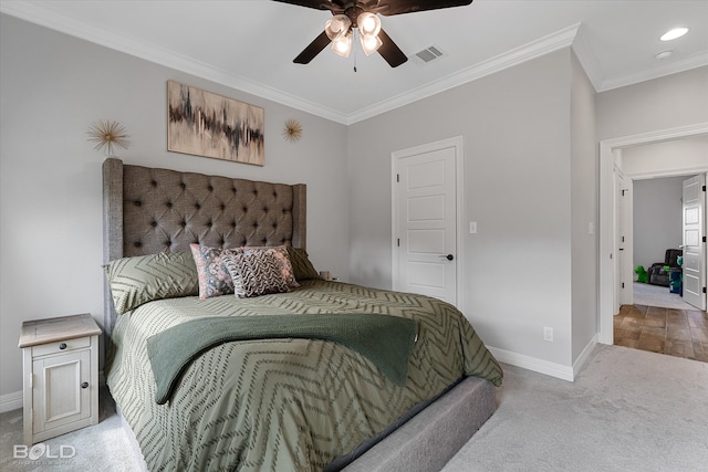 bedroom with ceiling fan, light colored carpet, and crown molding