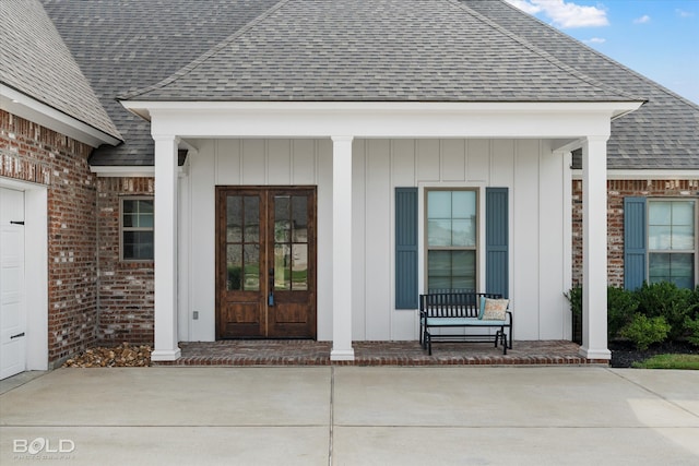 view of exterior entry with covered porch