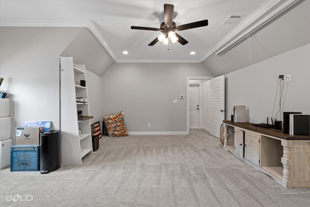 interior space with light colored carpet, crown molding, lofted ceiling, and ceiling fan