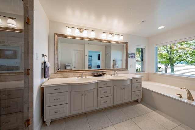 bathroom featuring vanity, plus walk in shower, and tile patterned floors