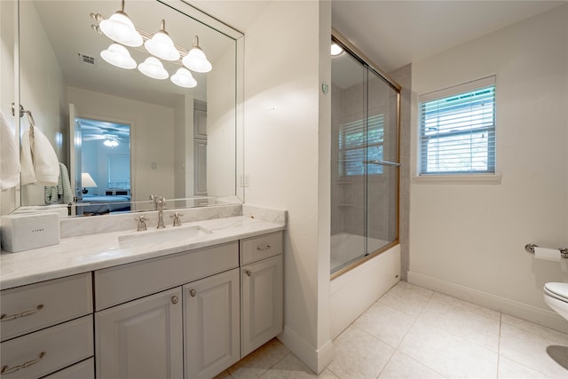 full bathroom featuring toilet, tile patterned flooring, vanity, ceiling fan, and enclosed tub / shower combo