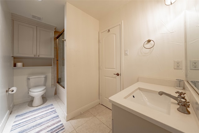 full bathroom with shower / bath combination with glass door, vanity, toilet, and tile patterned floors