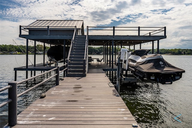 dock area with a water view