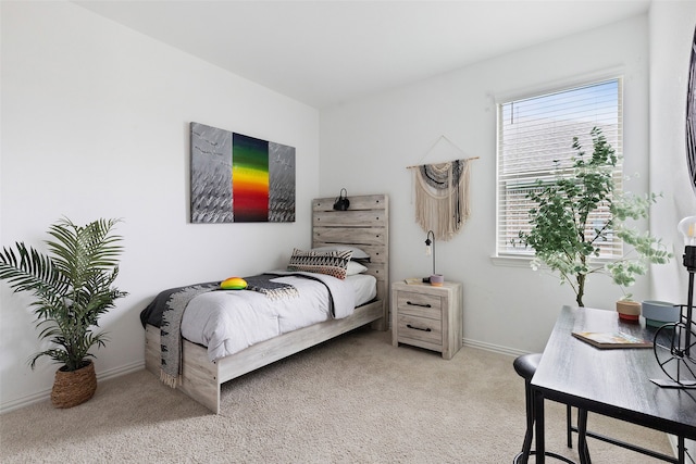 bedroom with light colored carpet