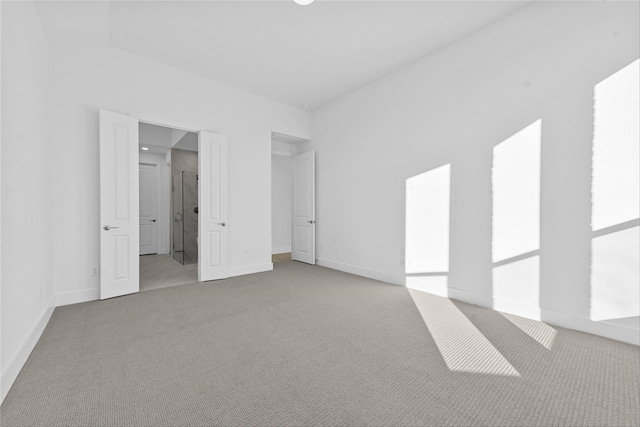 unfurnished bedroom with light carpet