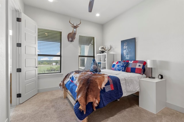 carpeted bedroom featuring ceiling fan