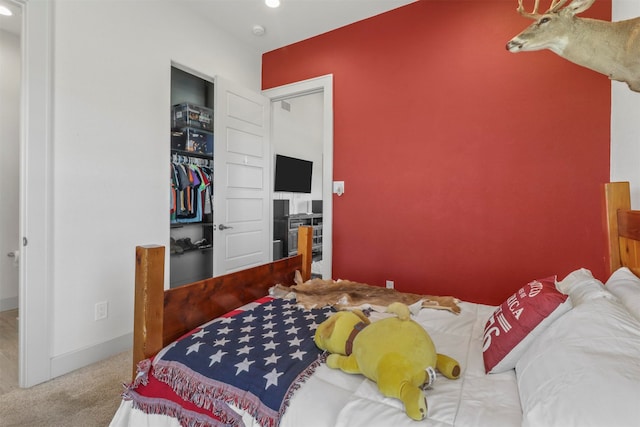 carpeted bedroom featuring a closet