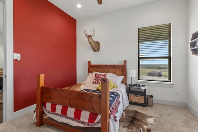 carpeted bedroom featuring ceiling fan