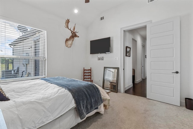 carpeted bedroom featuring vaulted ceiling