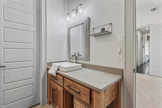 bathroom featuring hardwood / wood-style floors and vanity