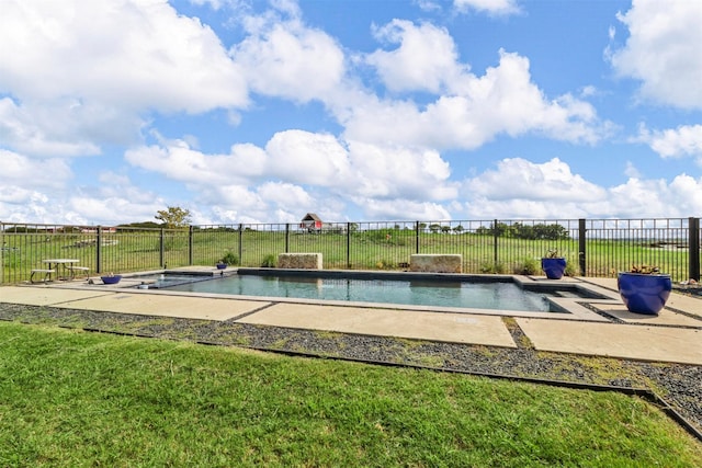 view of pool with a lawn