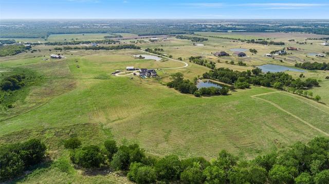 bird's eye view with a rural view and a water view