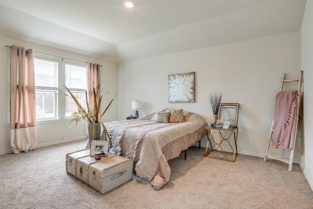 carpeted bedroom featuring lofted ceiling