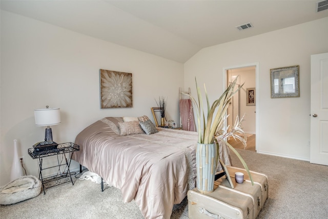 carpeted bedroom with vaulted ceiling