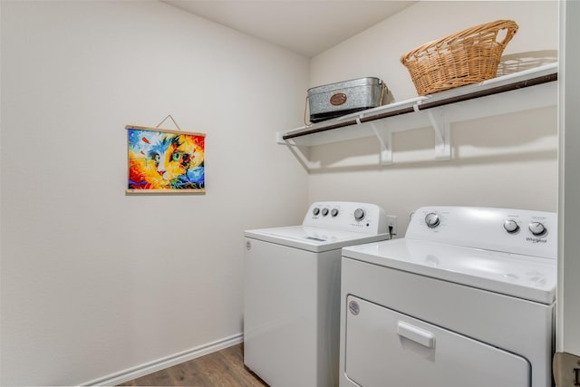 laundry room featuring dark wood-type flooring and washing machine and clothes dryer