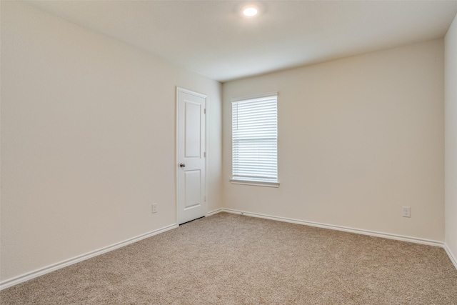 unfurnished room with carpet floors