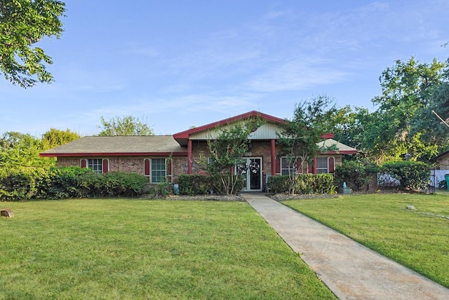 ranch-style house featuring a front lawn