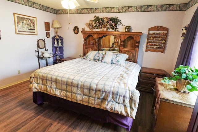 bedroom with hardwood / wood-style floors and ceiling fan