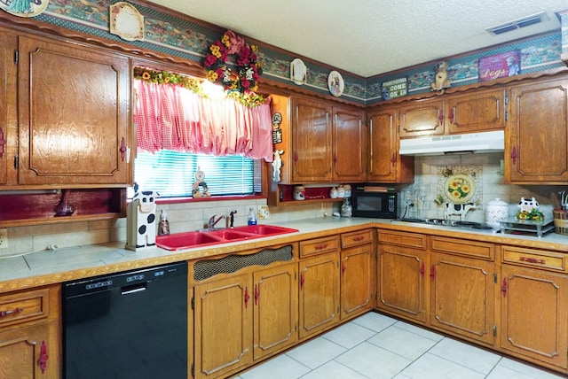 kitchen featuring backsplash, black appliances, sink, a textured ceiling, and light tile patterned flooring