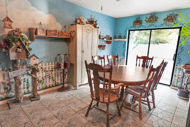 dining space featuring ceiling fan