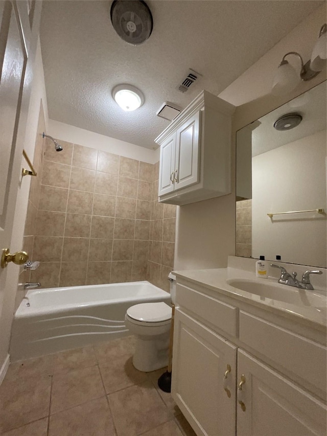 bathroom with bathing tub / shower combination, toilet, tile patterned flooring, a textured ceiling, and vanity