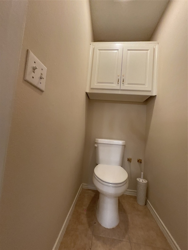 bathroom featuring toilet and tile patterned floors