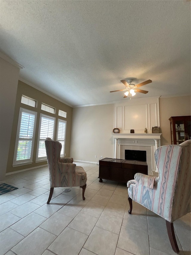 living room with crown molding, light tile patterned flooring, and a fireplace