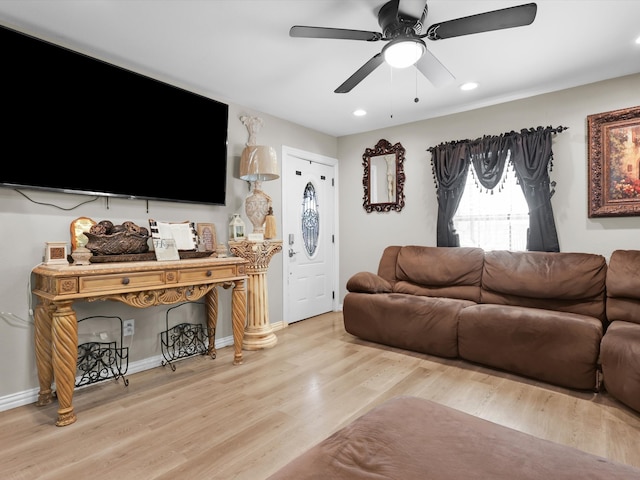 living room with ceiling fan and hardwood / wood-style floors