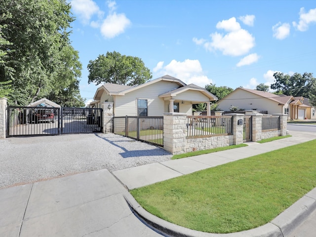 bungalow-style home with a front yard