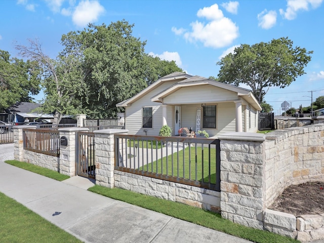 bungalow-style house featuring a front yard and a porch