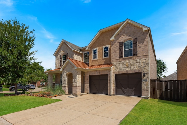 view of front facade featuring a garage and a front yard