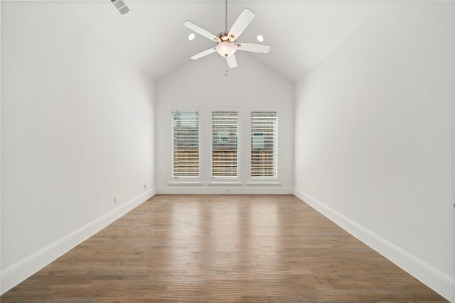 spare room featuring hardwood / wood-style flooring, ceiling fan, and lofted ceiling