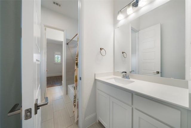 bathroom featuring vanity and bathing tub / shower combination