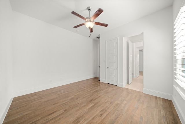 unfurnished bedroom featuring ceiling fan and light hardwood / wood-style floors