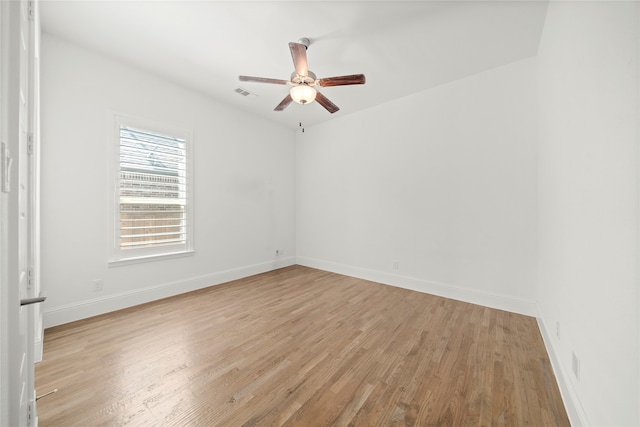 spare room featuring ceiling fan and light hardwood / wood-style floors