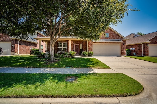 view of front facade with a garage and a front lawn