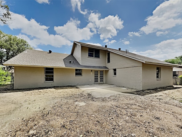 rear view of house featuring french doors and a patio area