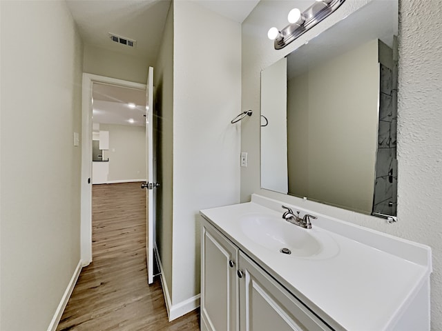 bathroom with wood-type flooring and vanity