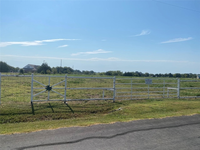 exterior space featuring a rural view and fence